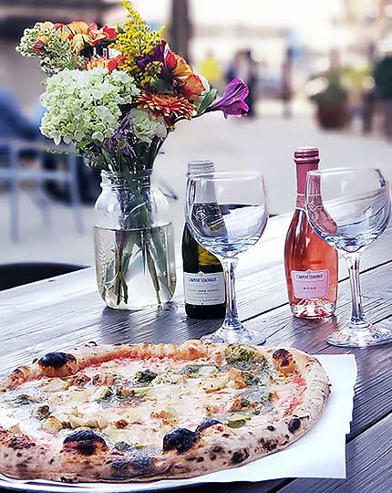 pizza with flowers and drinks